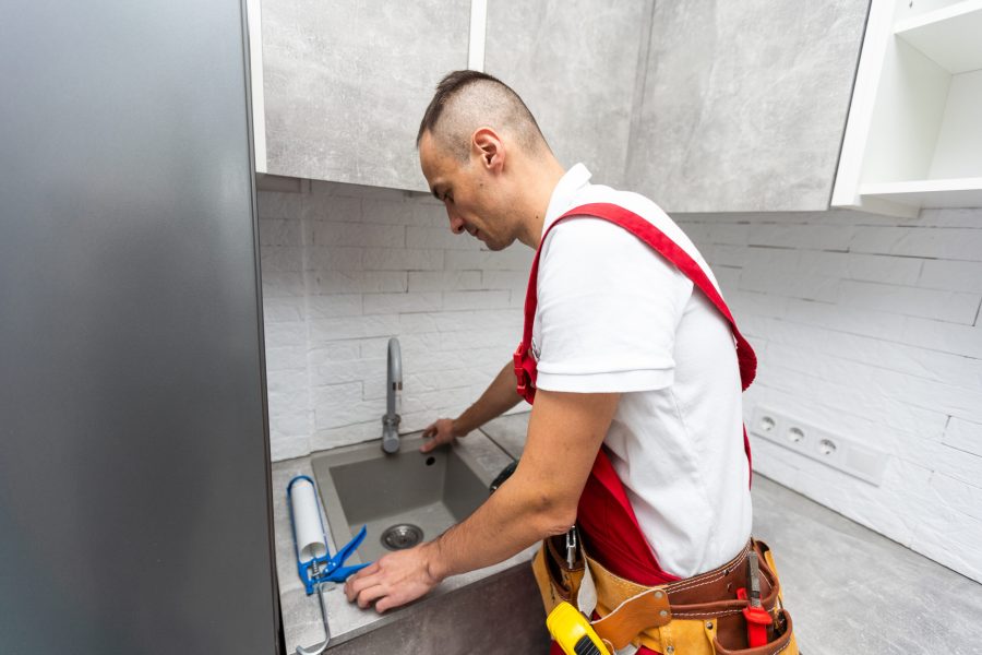 Cleaning Blocked Drain Clog In Kitchen Sink Using Plunger Cleaning Blocked Drain Clog In Kitchen Sink Using Plunger. High quality photo